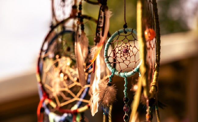 A collection of dreamcatchers hanging outside